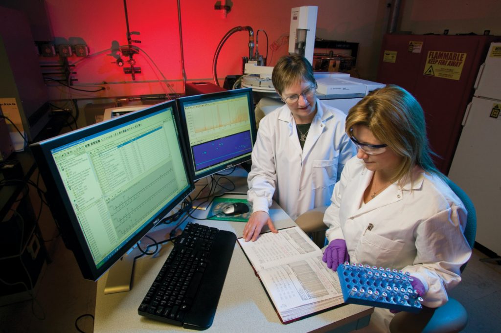 Two women scientists working in a laboratory.