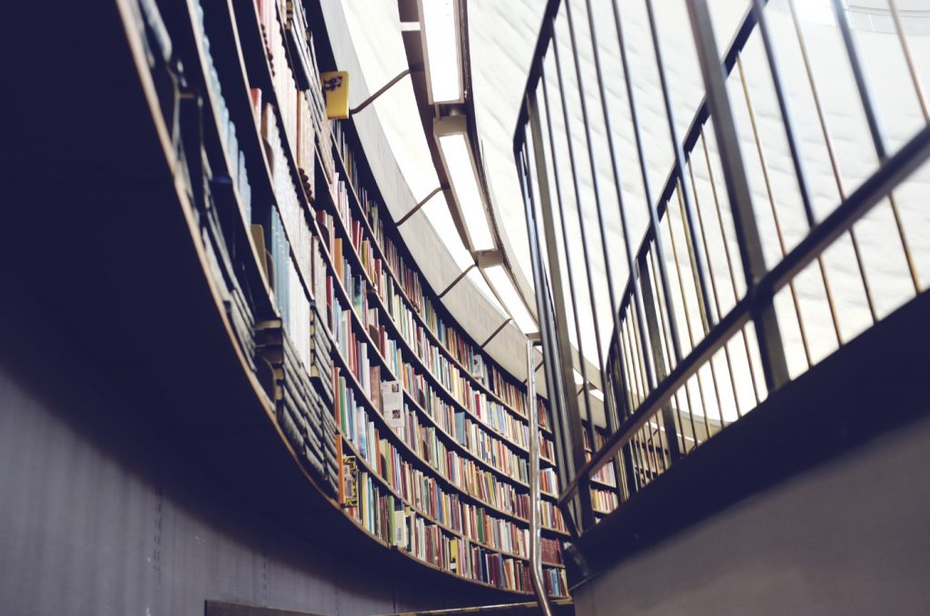 A library wall full of books.