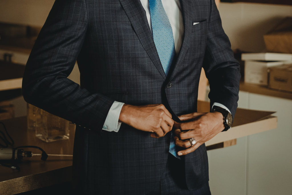 A person wearing a suit and a tie.