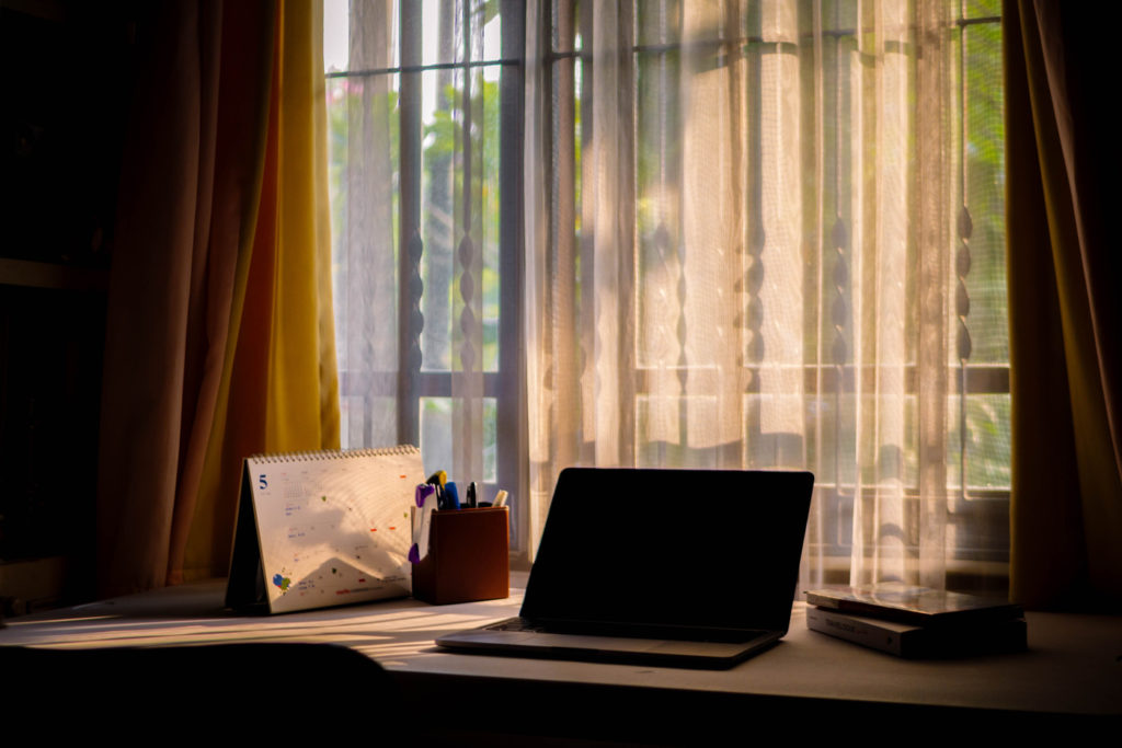 Powered-off laptop on a desk.