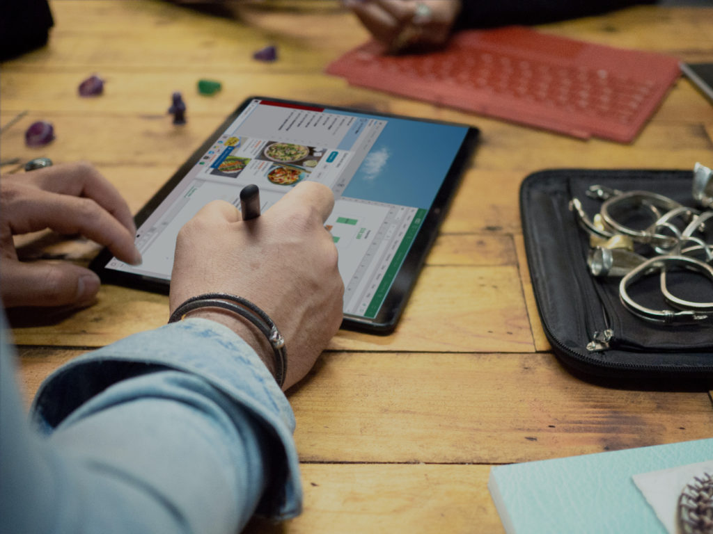 A person working on a tablet.