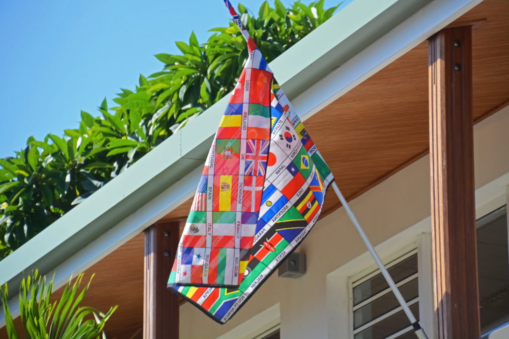 A banner that consists of flags of many different nations.