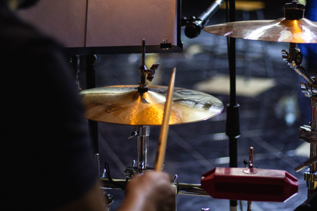 A person practicing drums.