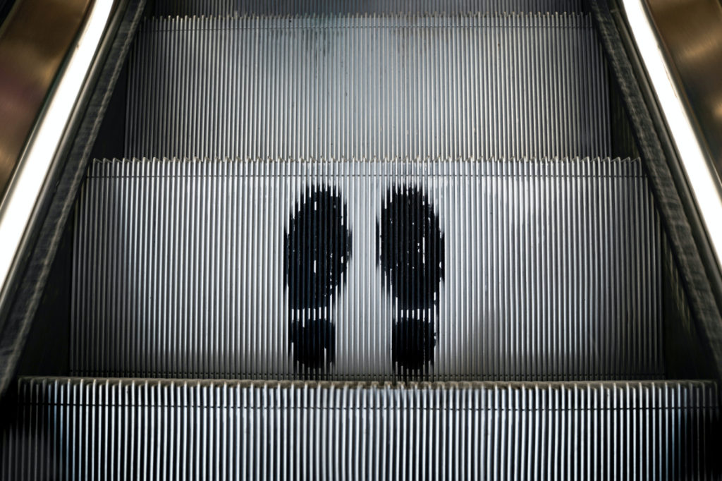 Footprints on an escalator.